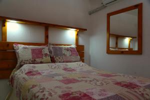 
A bed or beds in a room at La Buena Vida Apartamentos
