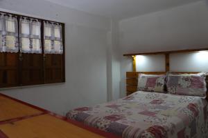 
A bed or beds in a room at La Buena Vida Apartamentos
