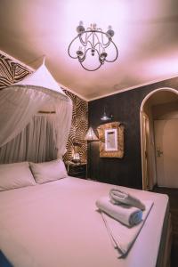 Postel nebo postele na pokoji v ubytování Ruby Rooms Kifisia