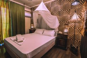 Postel nebo postele na pokoji v ubytování Ruby Rooms Kifisia
