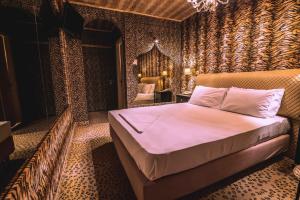 Postel nebo postele na pokoji v ubytování Ruby Rooms Kifisia
