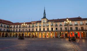 a large building with a plaza in front of it at NH Collection León Plaza Mayor in León
