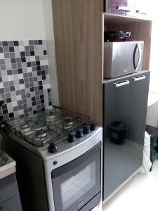 A kitchen or kitchenette at Minha Praia