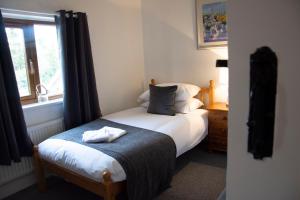 Katil atau katil-katil dalam bilik di Wensum Cottage