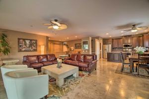 a living room with leather couches and a table at Gateway Grand Oasis Private Palm Springs Escape! in Palm Springs