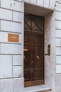 a door that is open in front of a building at Relais Rasella 47 in Rome