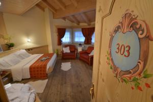Postel nebo postele na pokoji v ubytování Hotel Cristallo