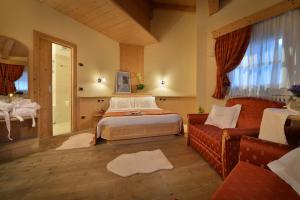 Postel nebo postele na pokoji v ubytování Hotel Cristallo