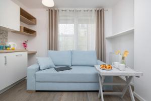 O zonă de relaxare la Apartament City Center Strzelecka by Renters