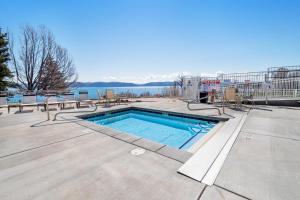a swimming pool with a view of the water at Bear Lake Blue in Garden City