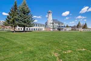 a large building with a tree in the middle of a field at Bear Lake Blue in Garden City