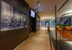 a hallway in a building with a wall with pictures on it at Point Hotel Taksim in Istanbul