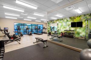 a gym with several treadmills and cardio machines at Wyndham Garden Orlando Universal / I Drive in Orlando