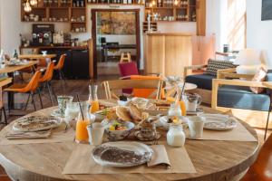 a wooden table with food on top of it at Hotel Boutique Palacio Ico in Teguise