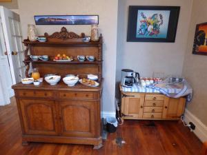 a room with a table with food on it at Sahara Guest House in Dunedin