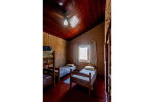 Cama o camas de una habitación en Casa c/ churrasqueira próximo à praia em Ubatuba