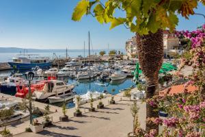 a group of boats docked in a marina at Apartment TOP TERRACE in Podgora