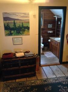 a room with a bathroom with a sink and a toilet at Talkeetna Roadhouse in Talkeetna