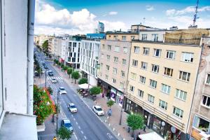 a view of a city street with cars and buildings at Morza Szum Studio Gdynia Świętojańska in Gdynia