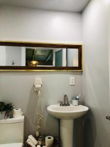 a bathroom with a sink and a mirror on the wall at Independent Studio in Little Havana in Miami +87 photos