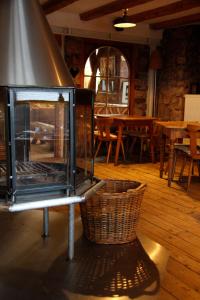 an open oven in a room with a basket at Zur Ewigen Lampe Romantisches Landhotel & Restaurant in Nideggen