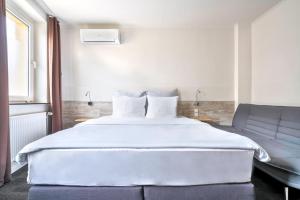 מיטה או מיטות בחדר ב-Design Hotel Wiegand