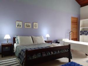 Cama ou camas em um quarto em Chalé na Montanha