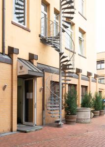 a spiral staircase on the side of a building at Design Hotel Wiegand in Hannover