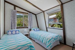Postelja oz. postelje v sobi nastanitve Pukenui Paradise - Havelock Holiday Home