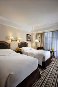 Postel nebo postele na pokoji v ubytování Hotel Gran Mahakam