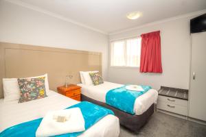 Voodi või voodid majutusasutuse BKs Premier Motel Esplanade toas