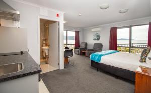Postel nebo postele na pokoji v ubytování BKs Premier Motel Esplanade + 35 fotografií