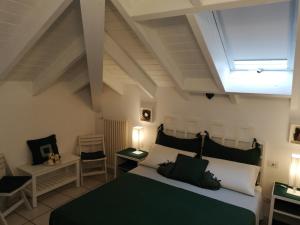 A bed or beds in a room at B&B LE MAGNOLIE