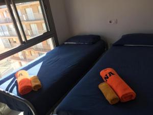Кровать или кровати в номере Apartamentos Marjal 3