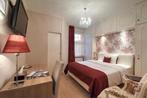 Voodi või voodid majutusasutuse Hotel Pavillon Du Zoute toas