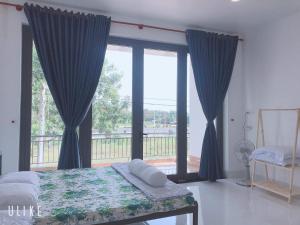 Postel nebo postele na pokoji v ubytování Minh Kim Guesthouse + 37 fotografií