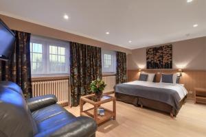 Voodi või voodid majutusasutuse Hotel Pavillon Du Zoute toas