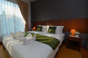 Postel nebo postele na pokoji v ubytování The Fusion Resort Hotel