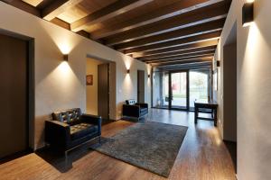 a living room with two chairs and a couch at Agriturismo La Razza in Reggio Emilia +44 photos