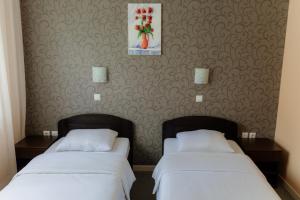 Postel nebo postele na pokoji v ubytování Hotel Drinska lasta