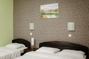 Postel nebo postele na pokoji v ubytování Hotel Drinska lasta