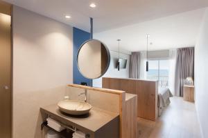 a bathroom with a sink and a mirror at Hotel Maritim in Roses