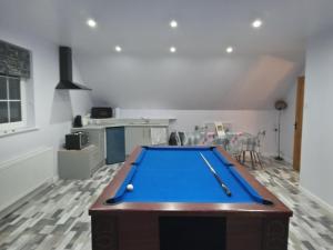 a living room with a pool table in it at Lyza's Loft in Kilcoo