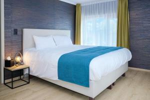 Кровать или кровати в номере Hotel & Restaurant Maison Pal'Ange