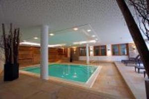 a swimming pool in the middle of a house at Avenida Mountain Resort A11 in Kaprun
