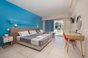 Voodi või voodid majutusasutuse Poseidon Beach Hotel toas