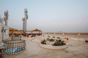 a large patio with a view of the desert at Desert Moon in Cairo +54 photos