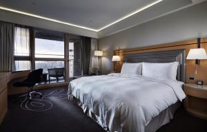 Voodi või voodid majutusasutuse K Hotel Taipei Songjiang toas
