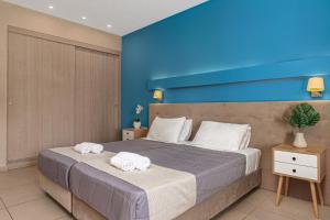 Voodi või voodid majutusasutuse Poseidon Beach Hotel toas