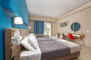 Voodi või voodid majutusasutuse Poseidon Beach Hotel toas